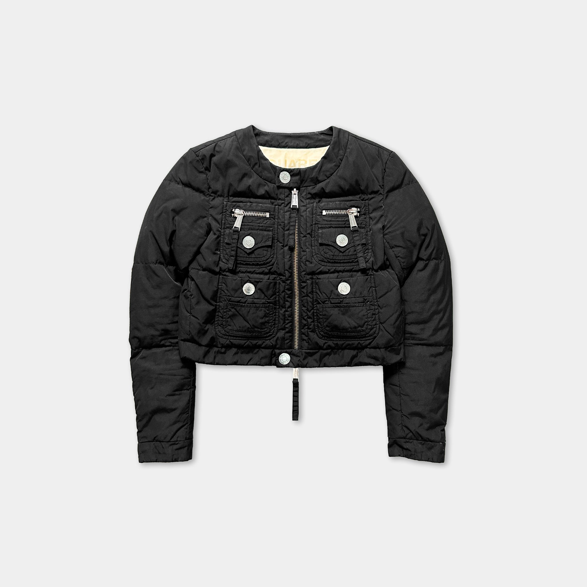 A black puffer jacket with multiple pockets and zippers.