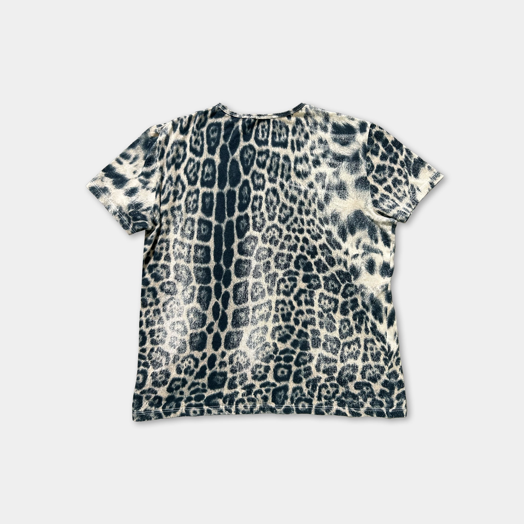 a black and white patterned t-shirt with a leopard print design.