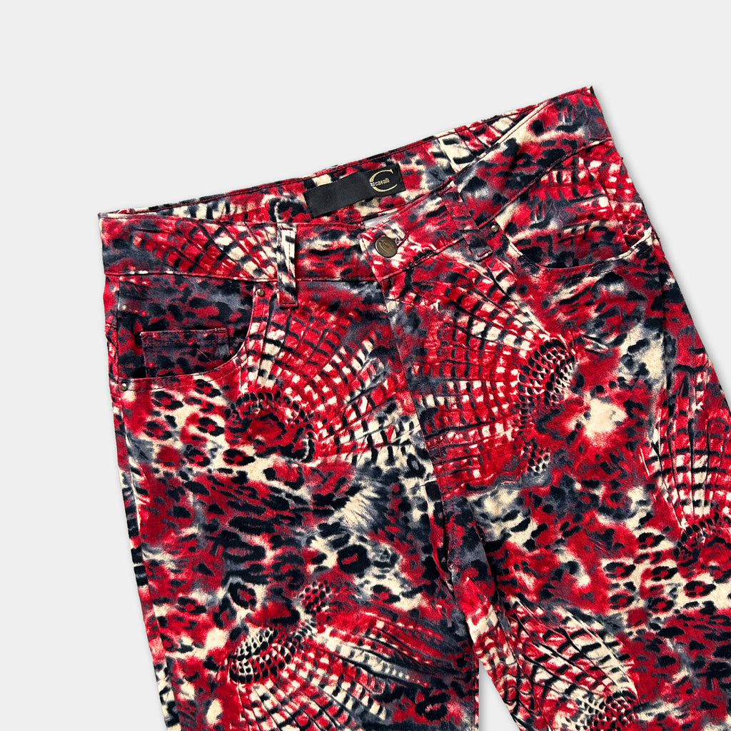 A pair of red and black patterned jeans with a leopard print design.