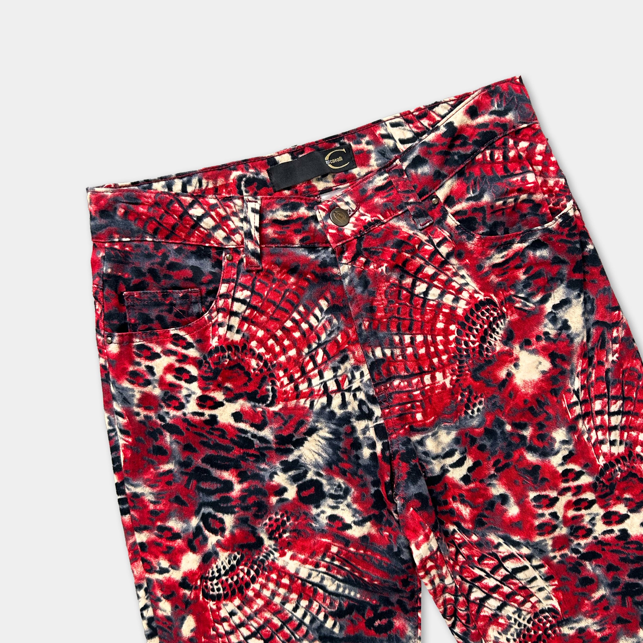 A pair of red and black patterned jeans with a leopard print design.