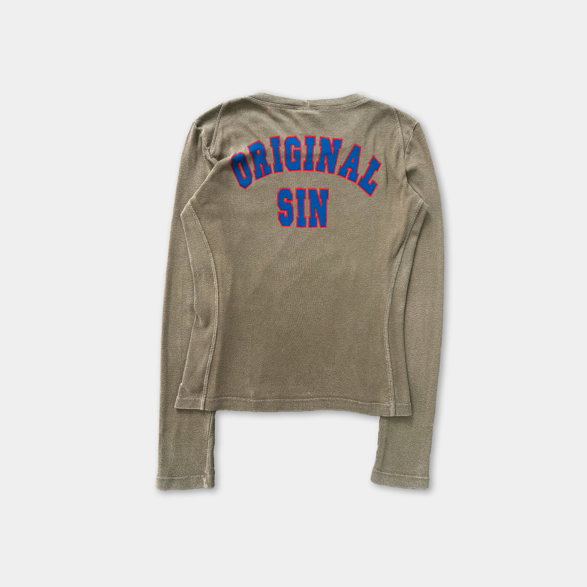 A beige long-sleeved shirt with the text "ORIGINAL SIN" printed in blue and red on the back.