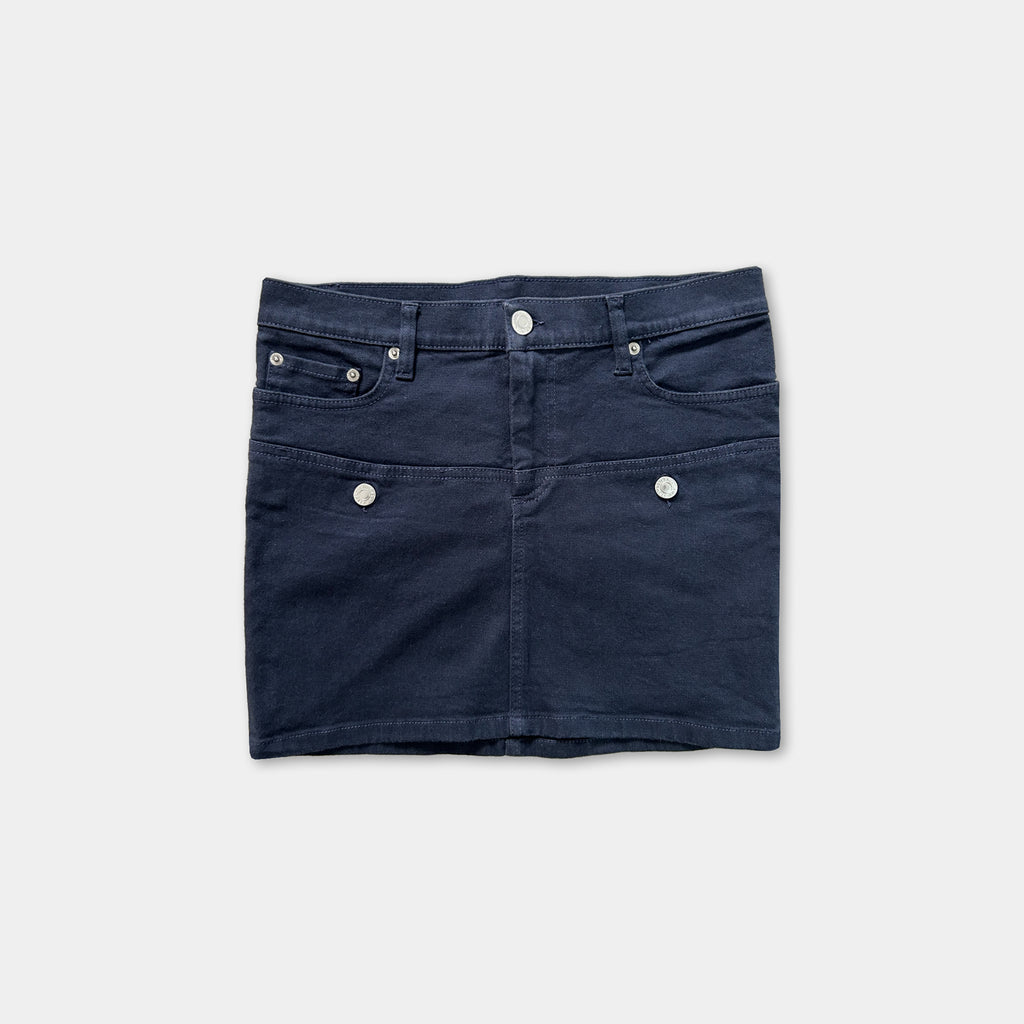A navy blue mini skirt with three pockets and buttons.