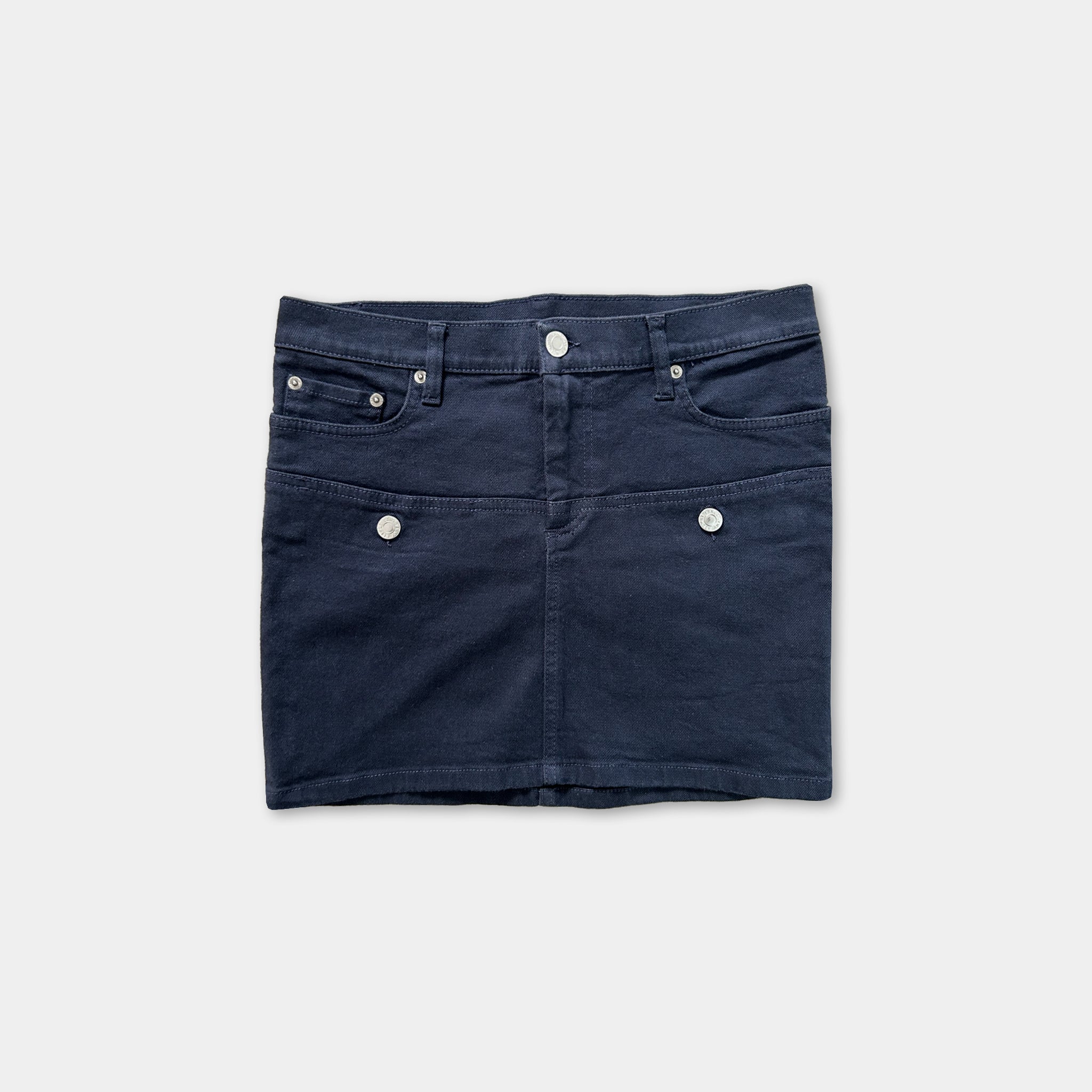 A navy blue mini skirt with three pockets and buttons.
