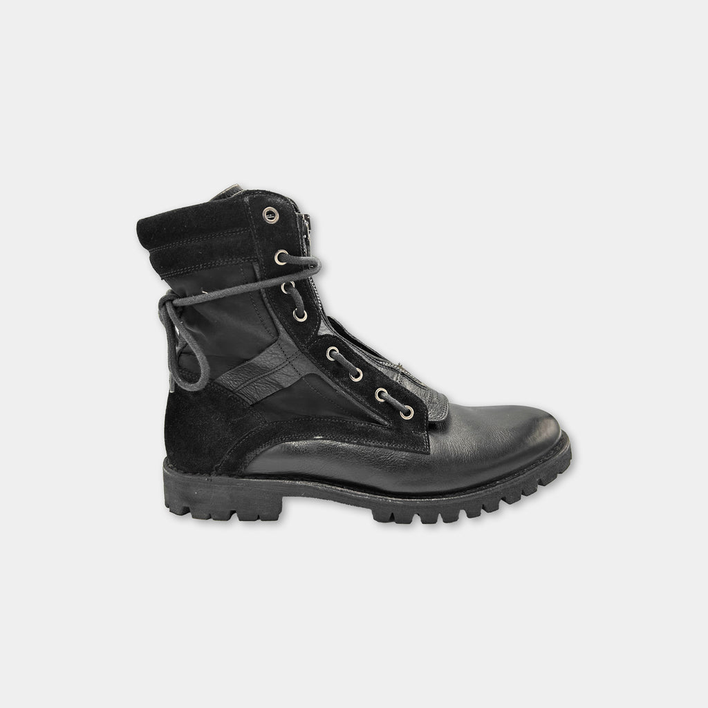 A black leather boot with a rugged sole and multiple laces.