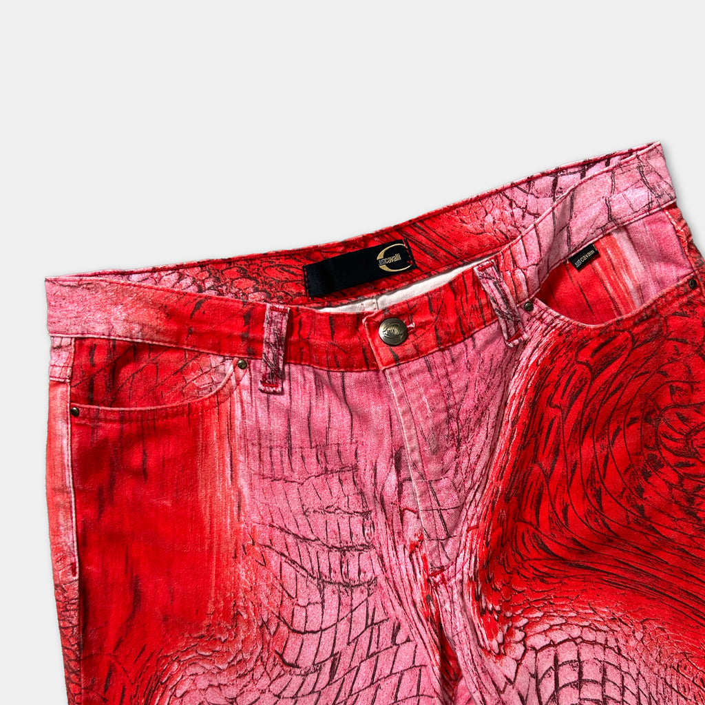 A pair of red patterned jeans with a distinctive design.