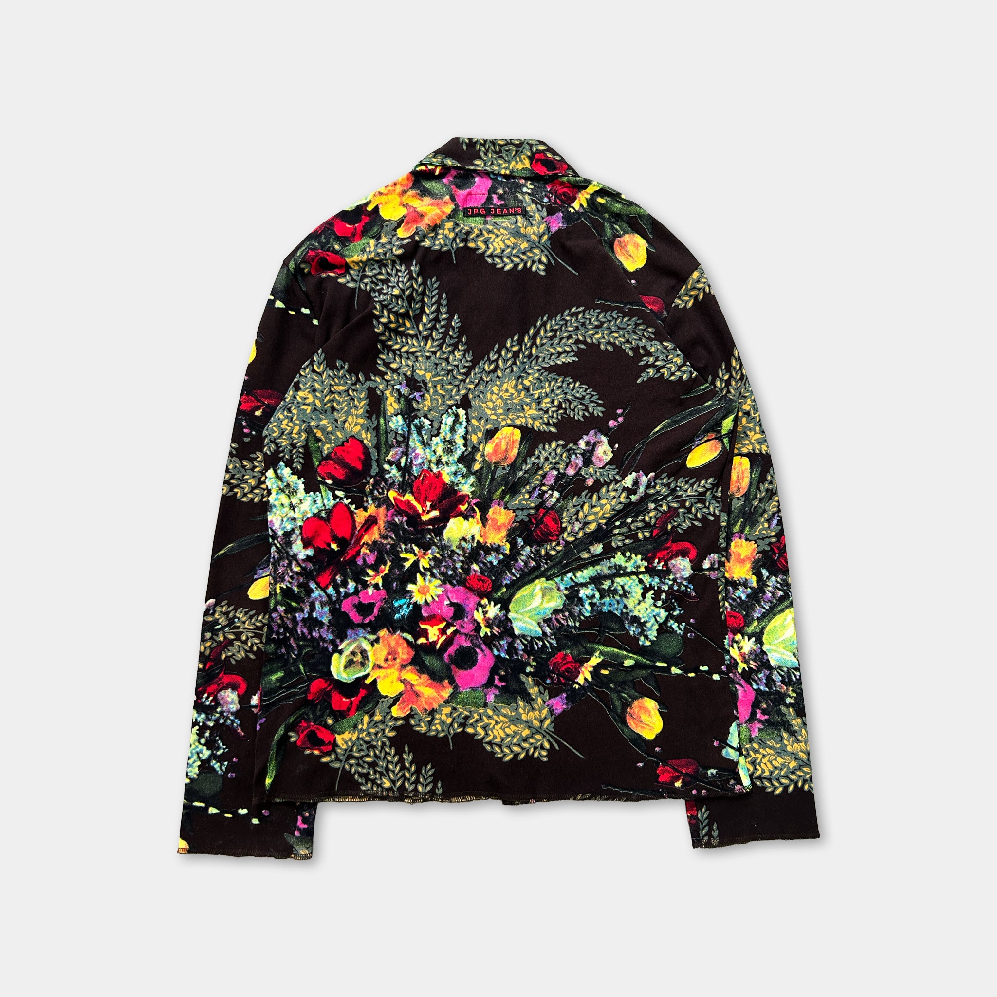 a colorful floral print jacket or shirt with a vibrant, abstract floral pattern.