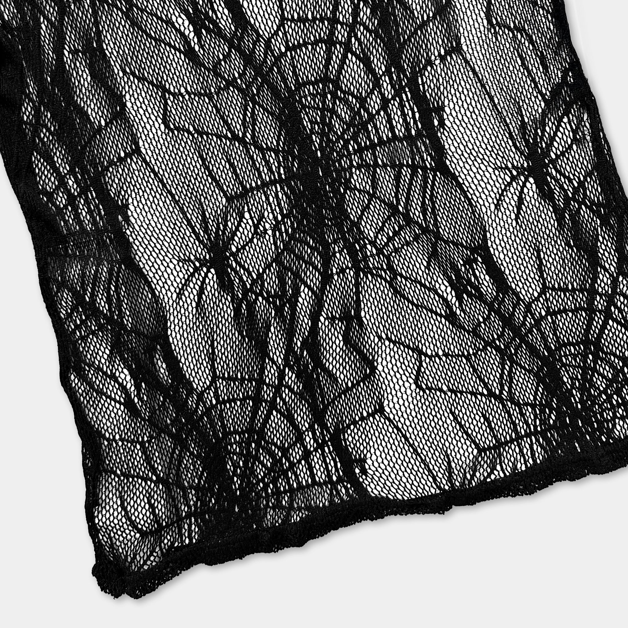 a close-up view of a black lace fabric with a complex, intricate pattern.