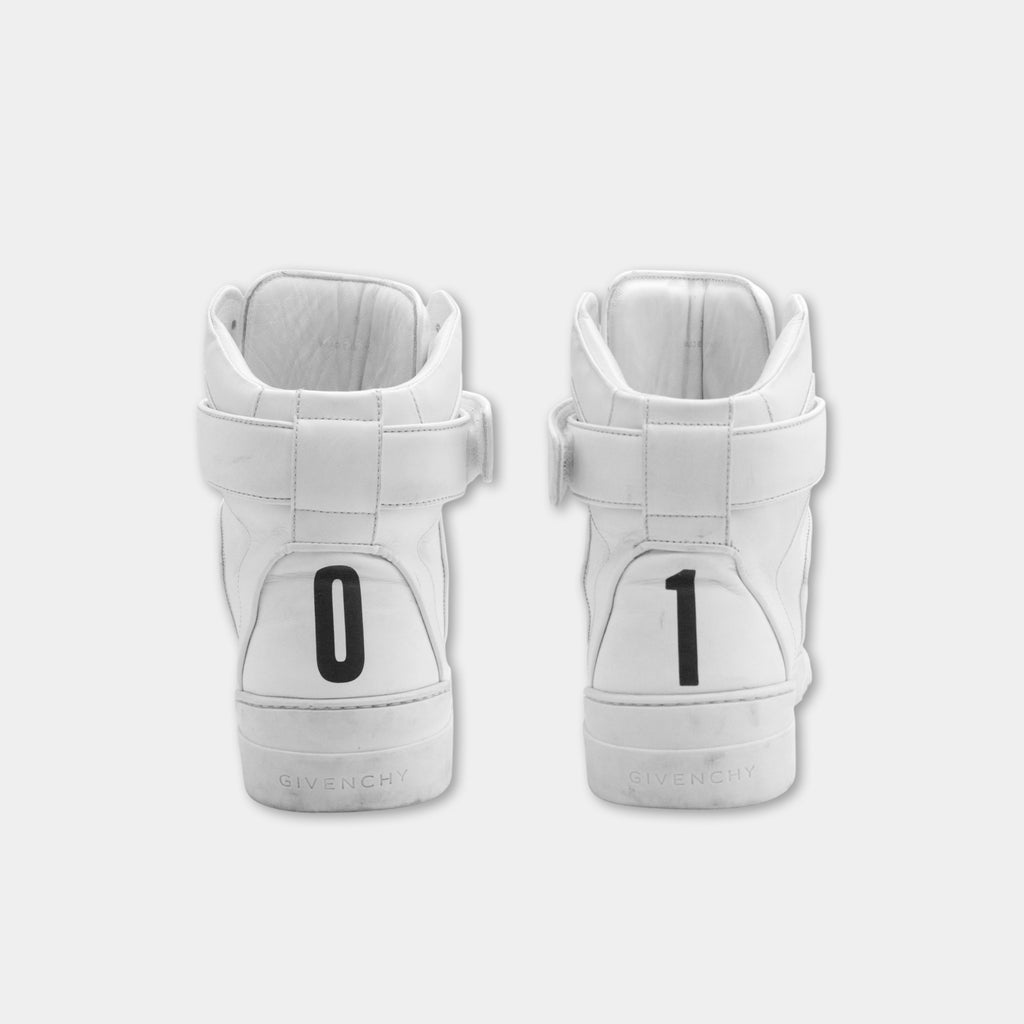 a pair of white high-top sneakers with the number "1" printed on the back.