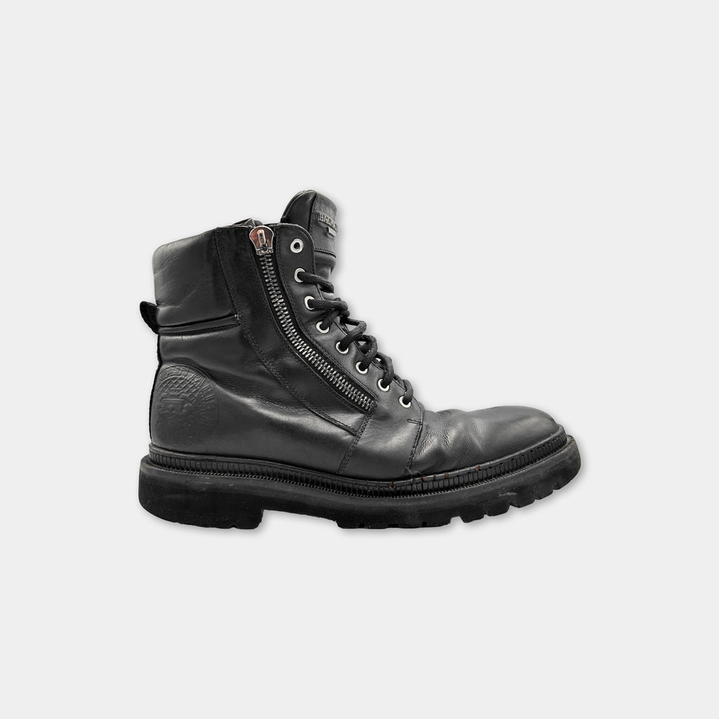 A single black leather boot with a zipper closure and a rugged sole.