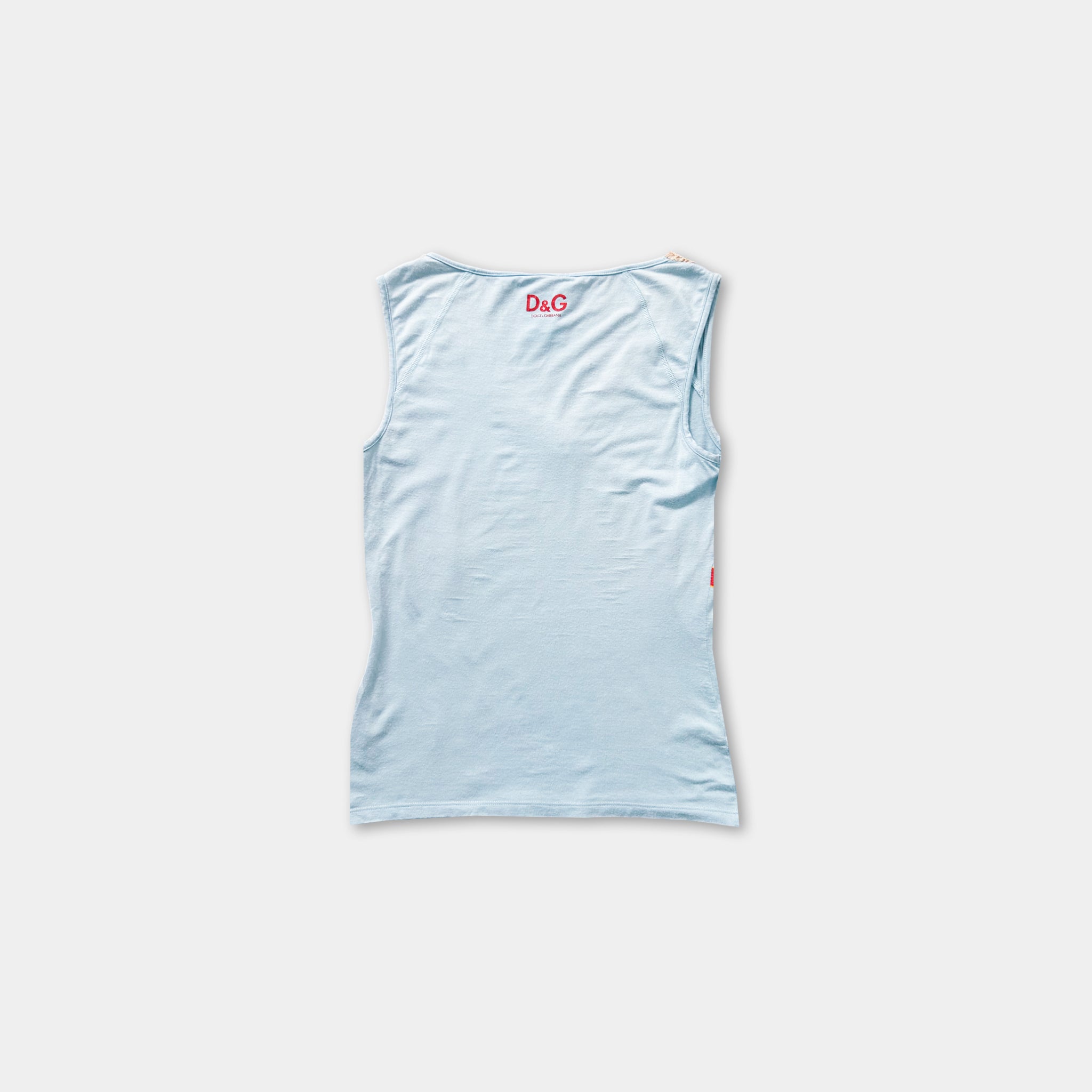 A light blue sleeveless top is shown against a white background.