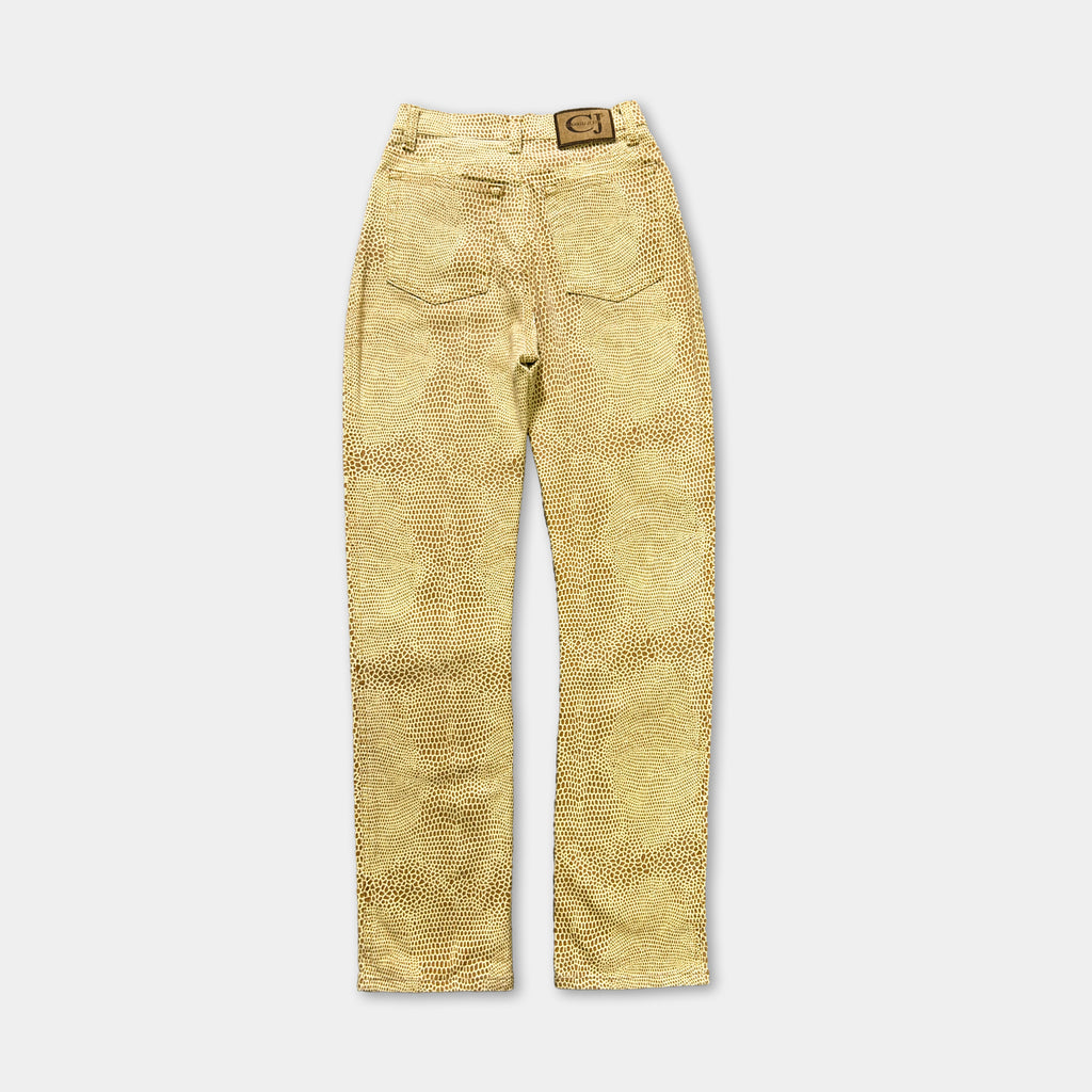 A pair of tan-colored jeans with a patterned design.