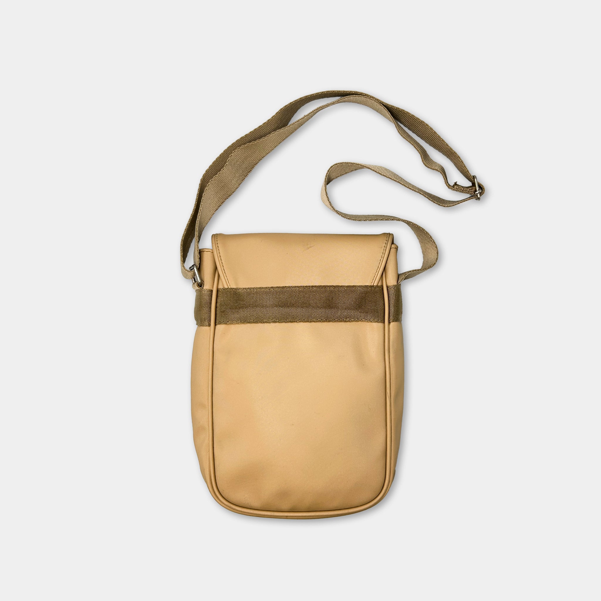 A tan leather crossbody bag with a brown strap and a small pocket on the front.