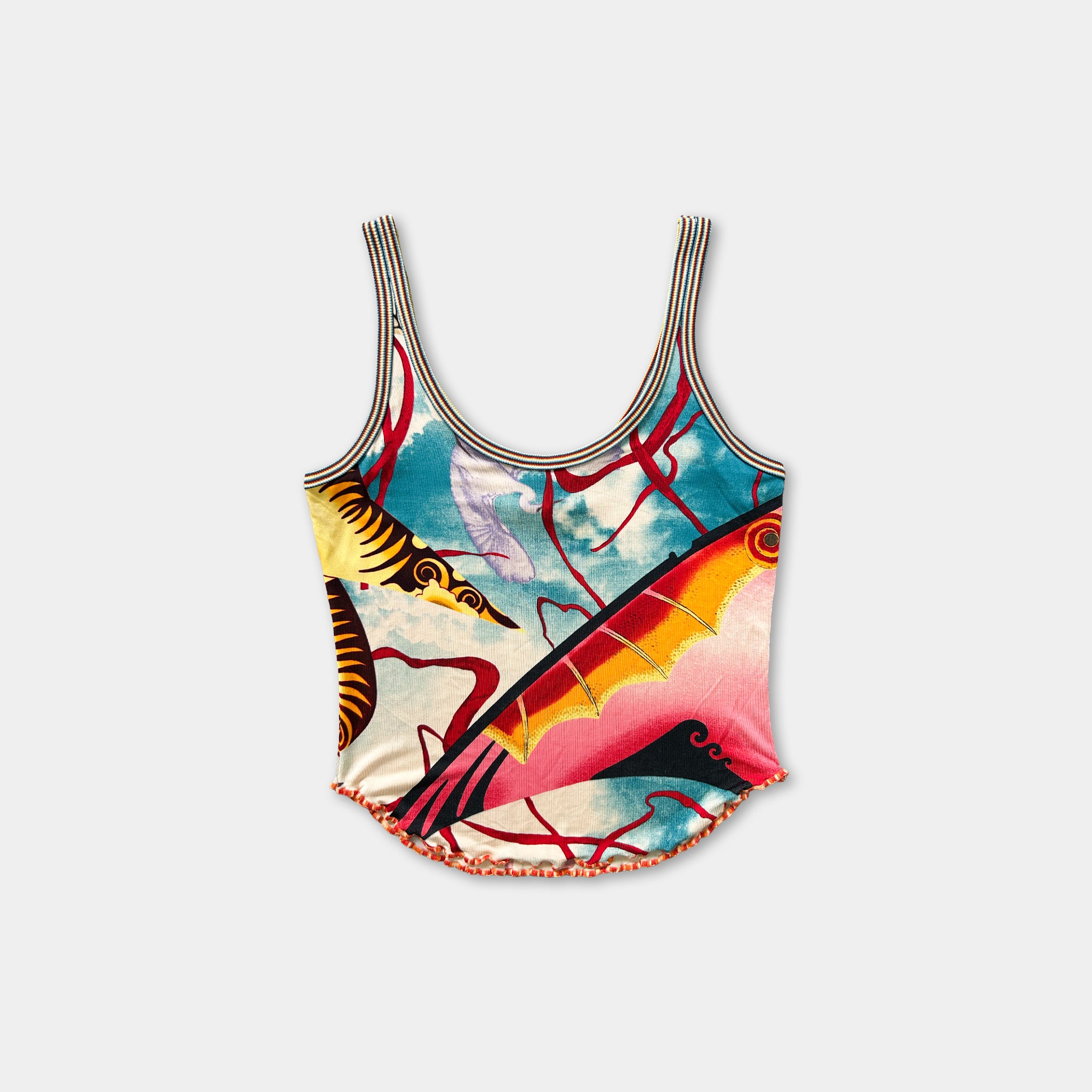 A colorful, patterned tank top with a vibrant design featuring various elements such as fish, flowers, and abstract shapes.