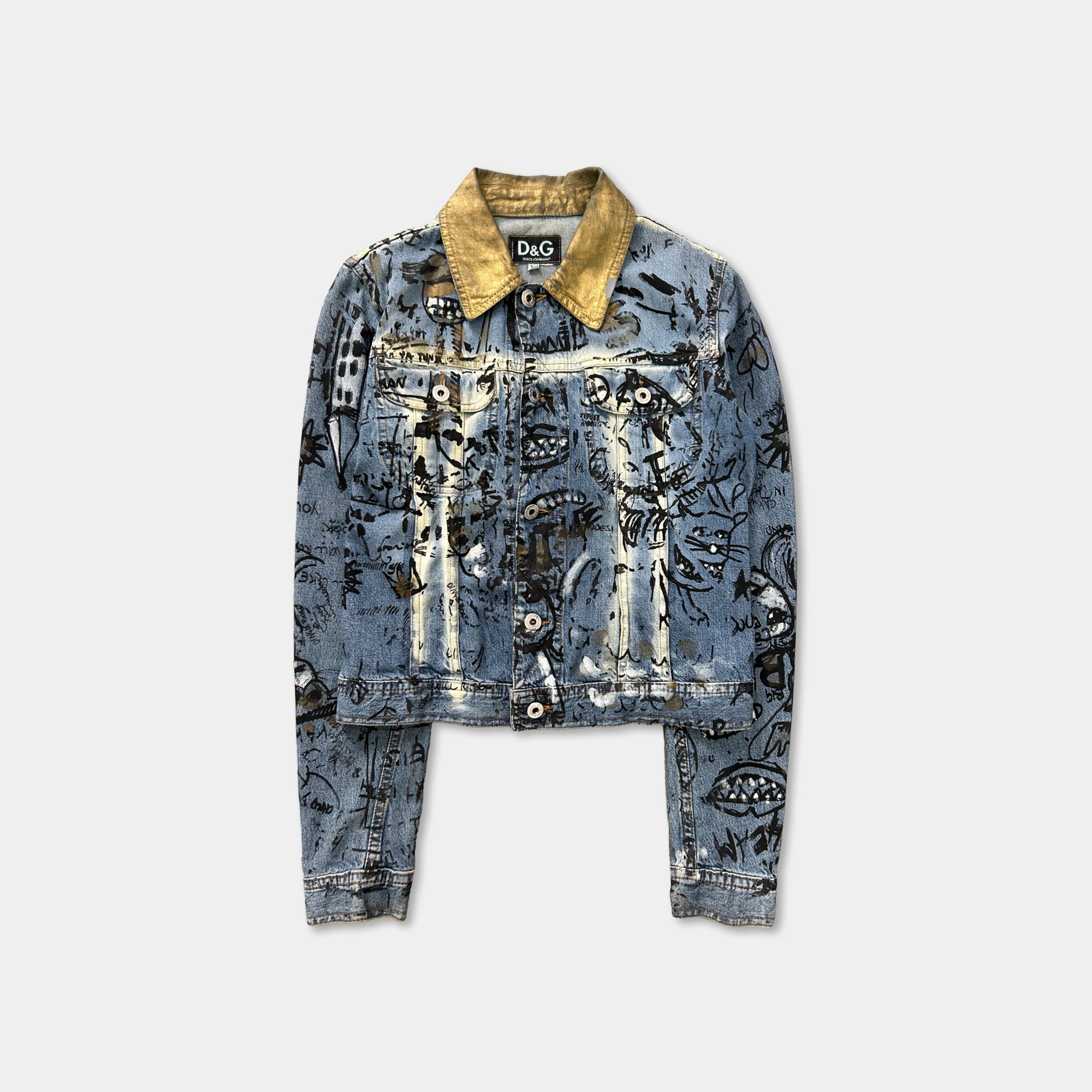 A denim jacket with a yellow collar and a unique, graffiti-style design on the front.