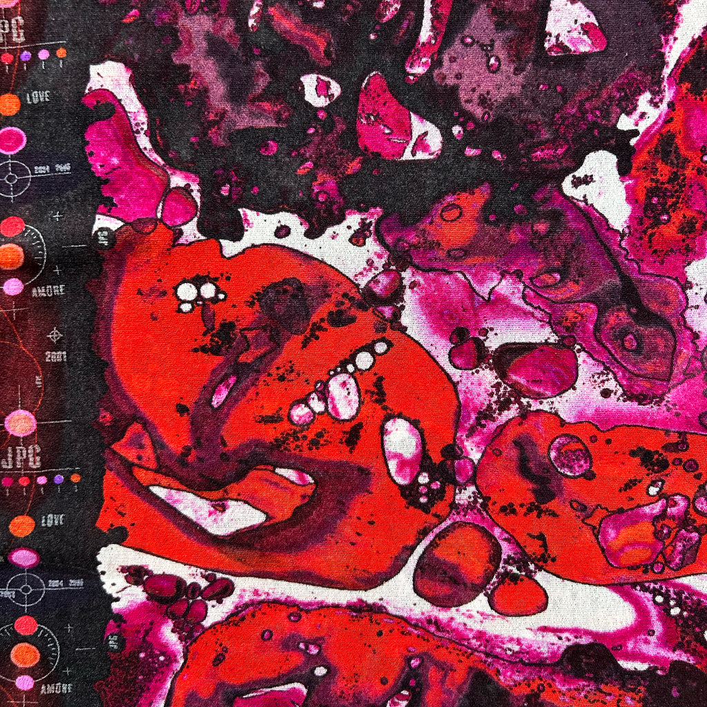 The image is a vibrant abstract painting with bold, overlapping shapes in shades of red, pink, and black. The painting features a mix of organic and geometric forms, creating a dynamic and visually striking composition.