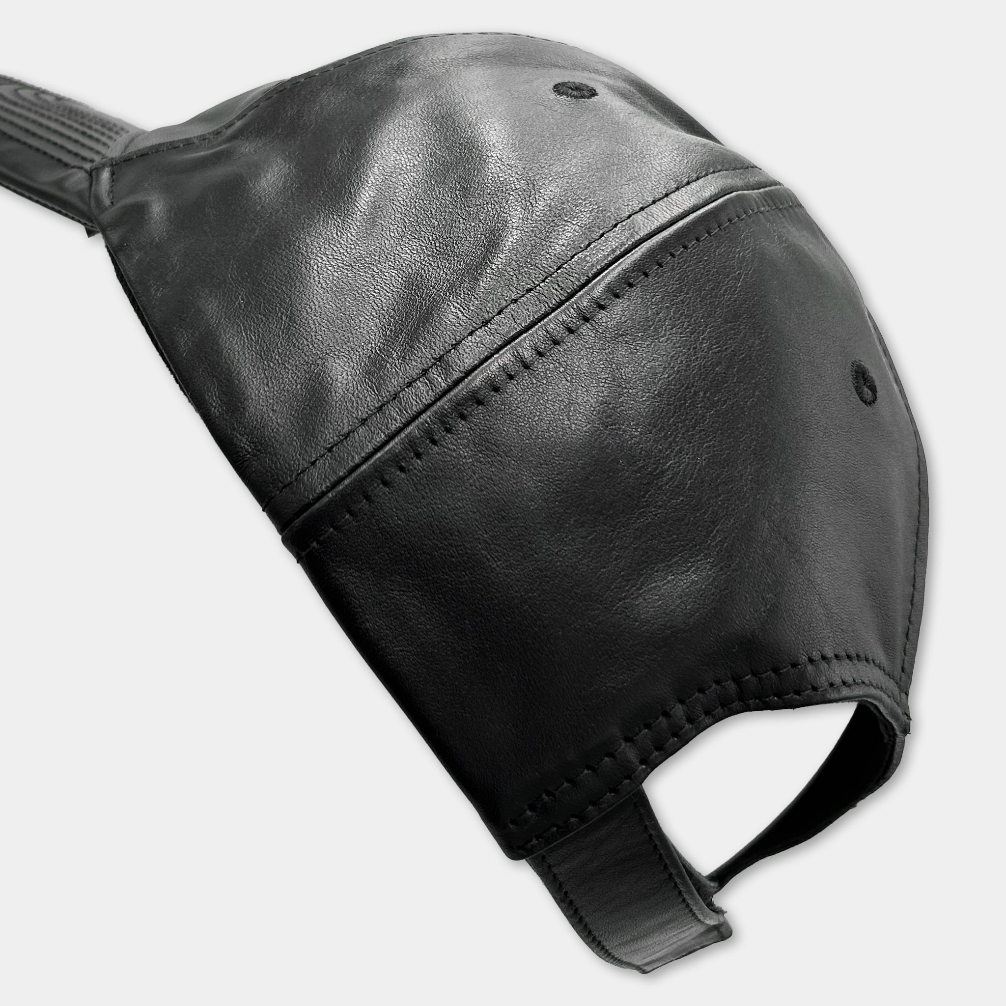 A black leather baseball cap with a curved brim and a small pocket on the front.
