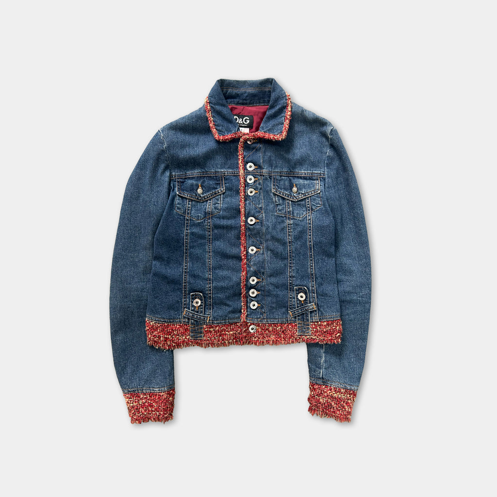 A denim jacket with red trim and buttons, displayed against a white background.