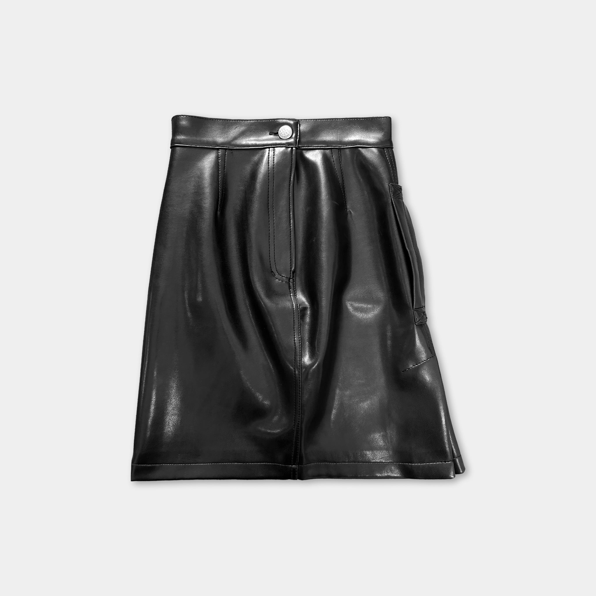 A black leather skirt with a button waist and a pocket on the front.