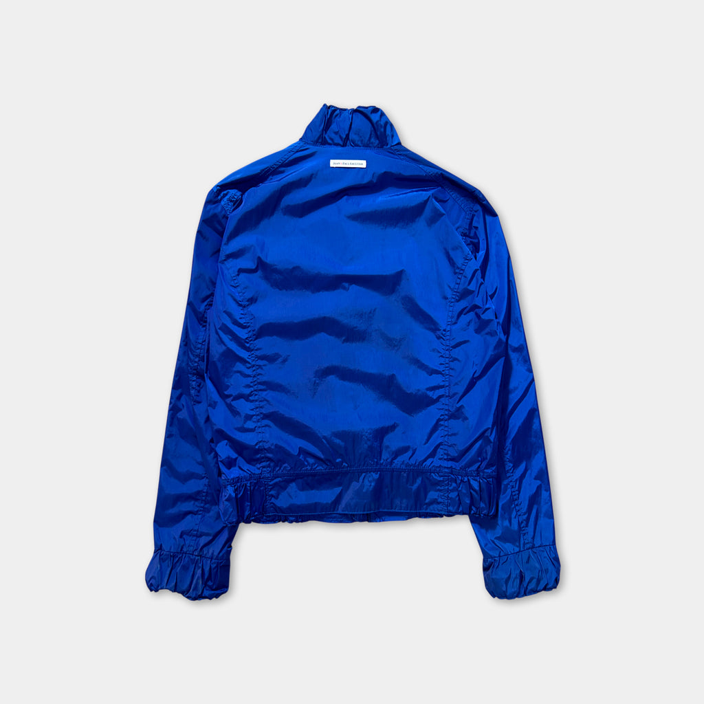 A blue jacket with a high collar and long sleeves is shown against a white background.