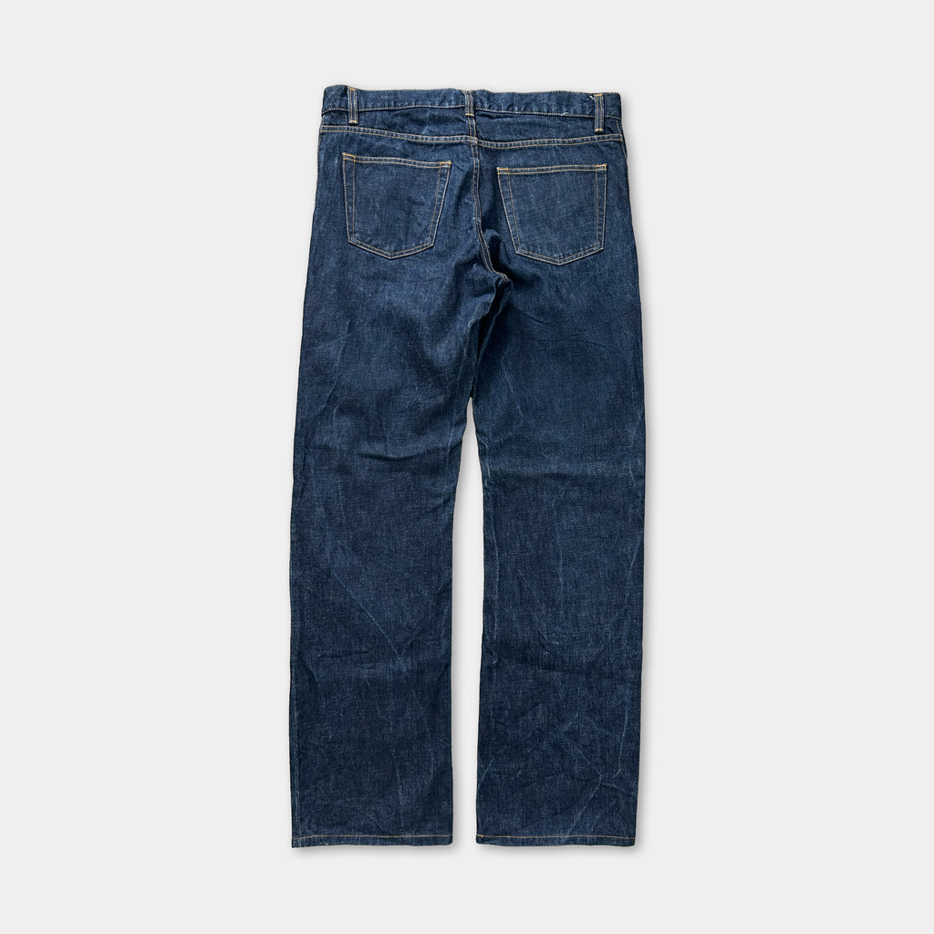 A pair of blue jeans with a classic design, featuring a pocket on the back and a zipper running down the front.