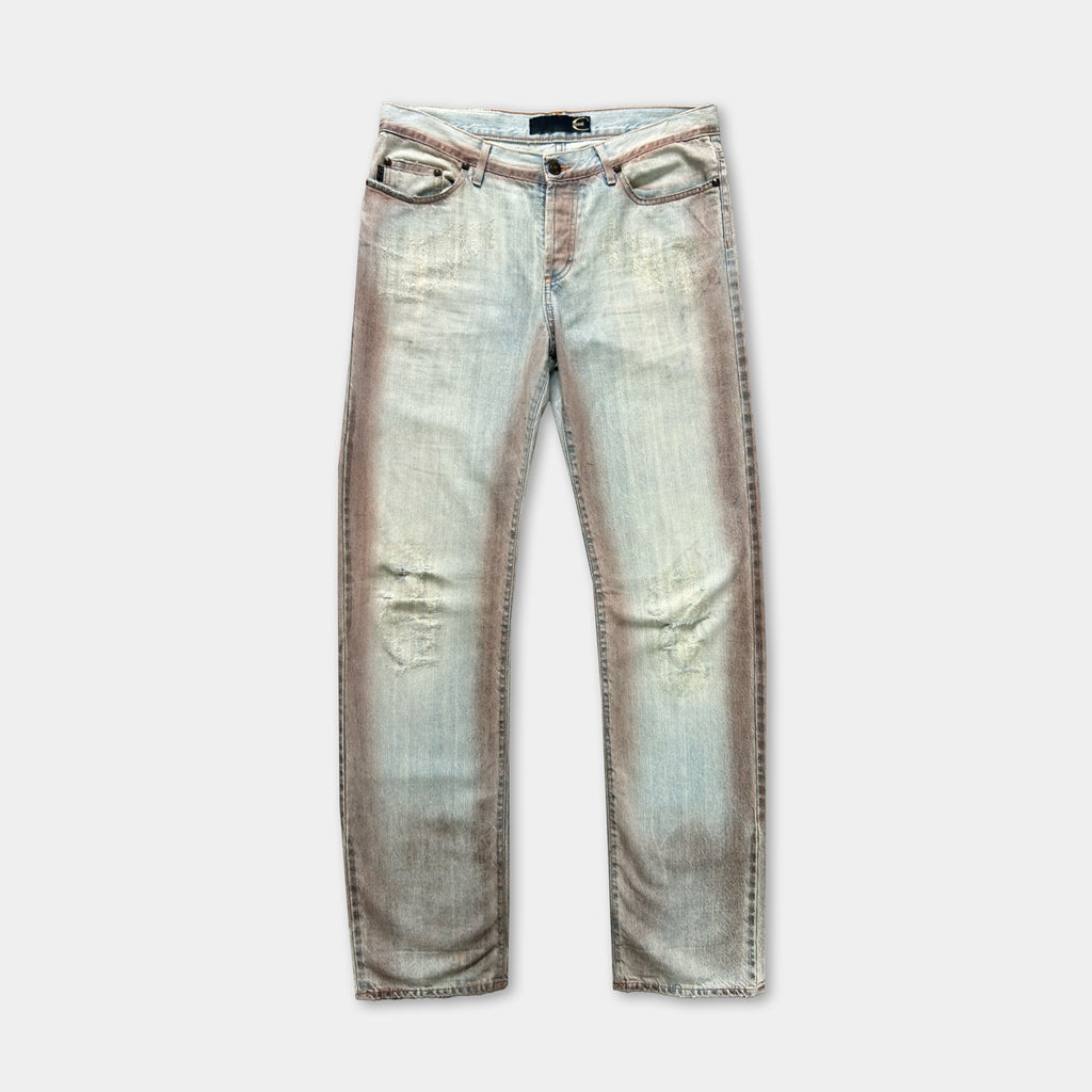A pair of light blue, distressed jeans with a faded, worn appearance.