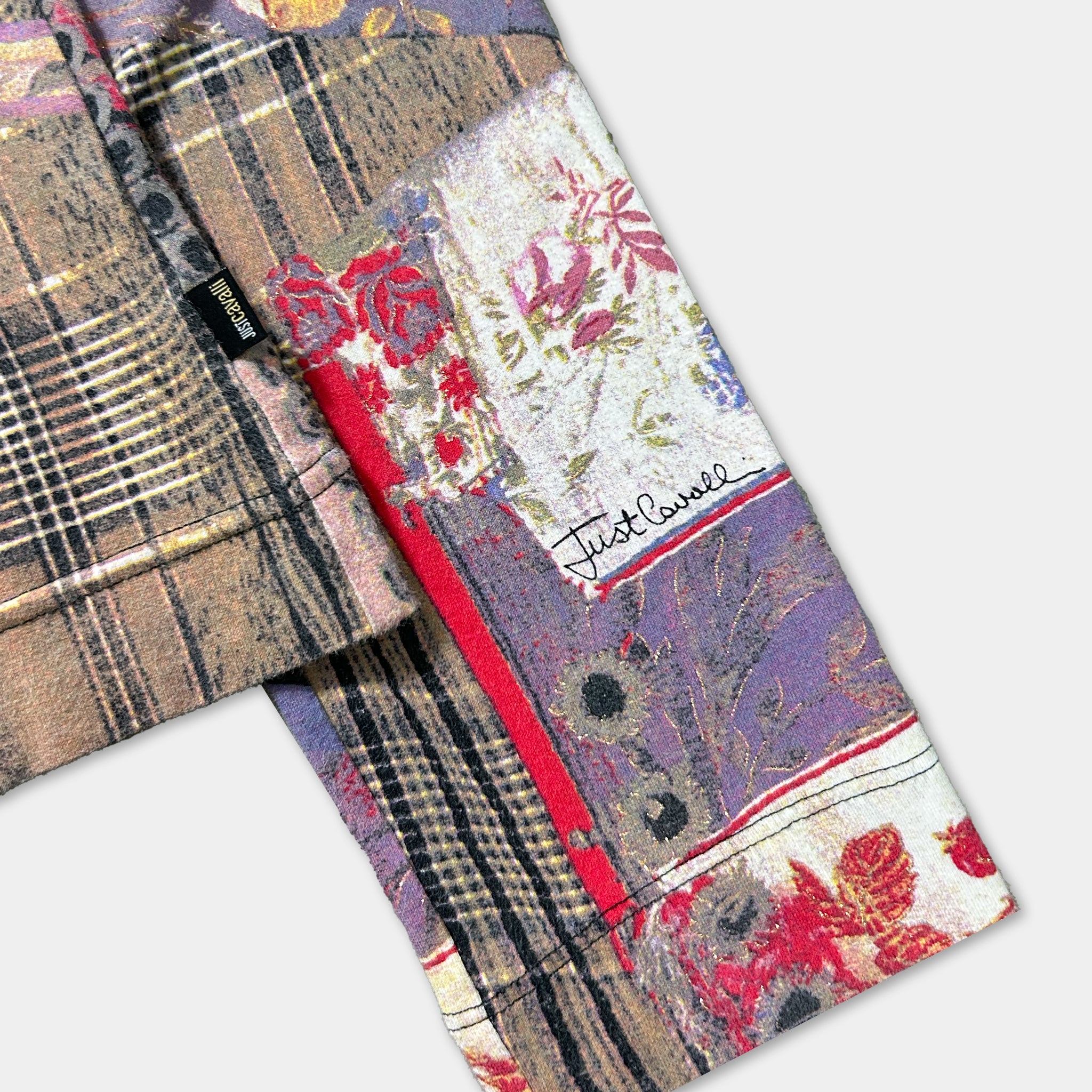 a close-up view of a colorful, patterned fabric with a floral design.