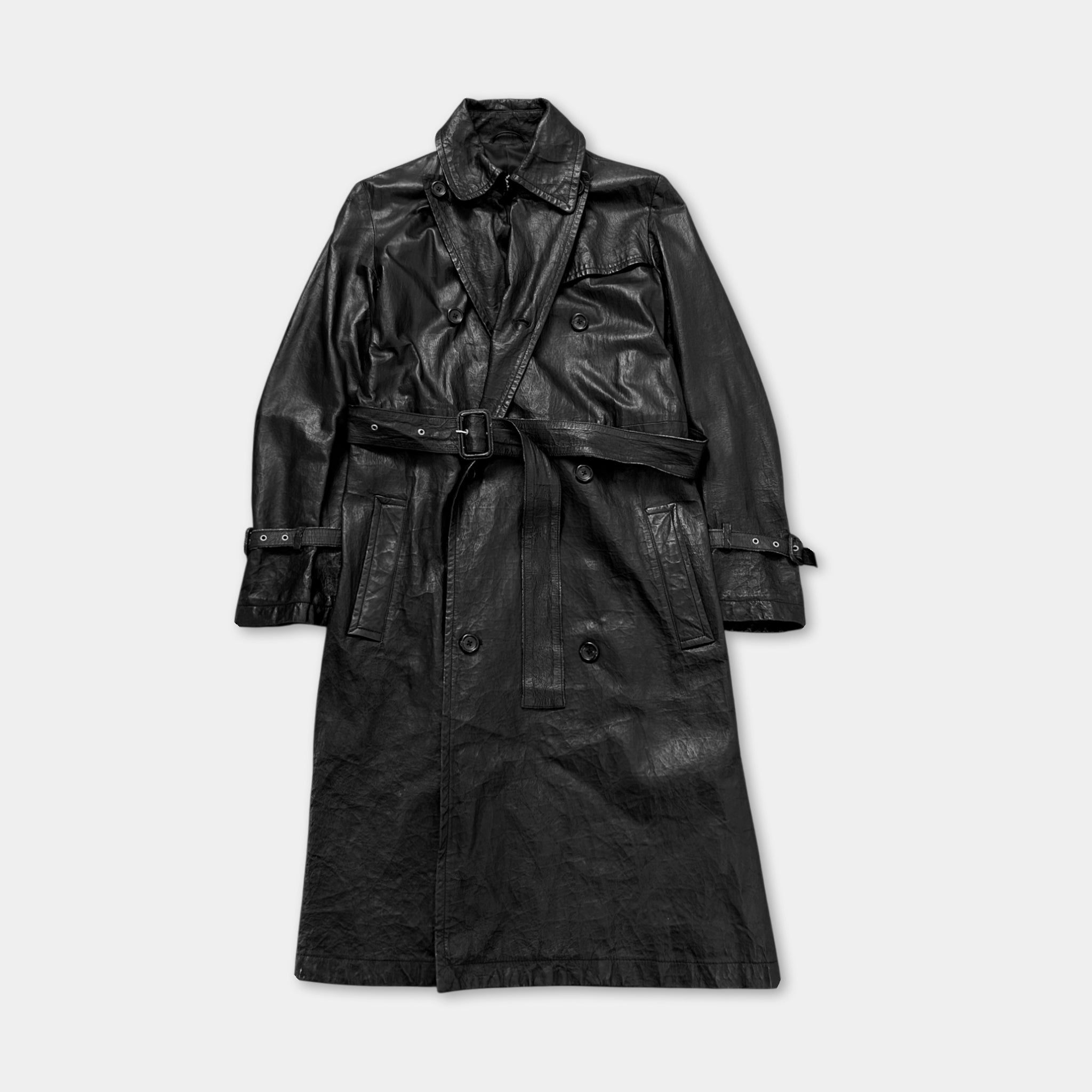 A black leather trench coat with a double-breasted design and a belt, displayed against a plain background.