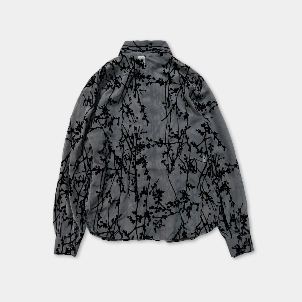 a gray jacket with a black floral pattern on the back.