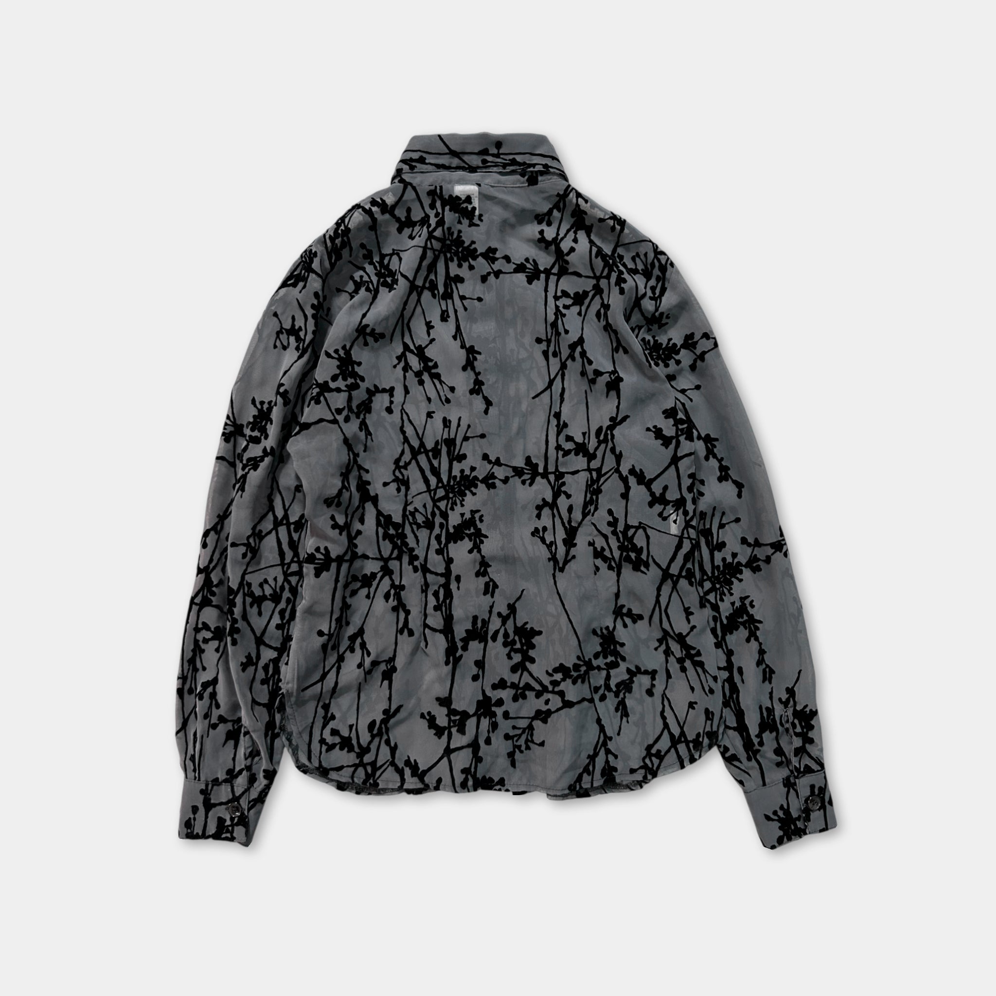 a gray jacket with a black floral pattern on the back.