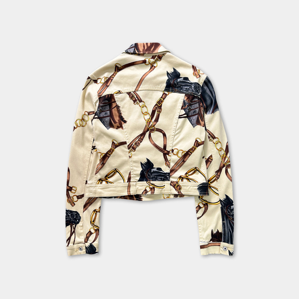 a beige jacket with a pattern of horses and chains on the back.