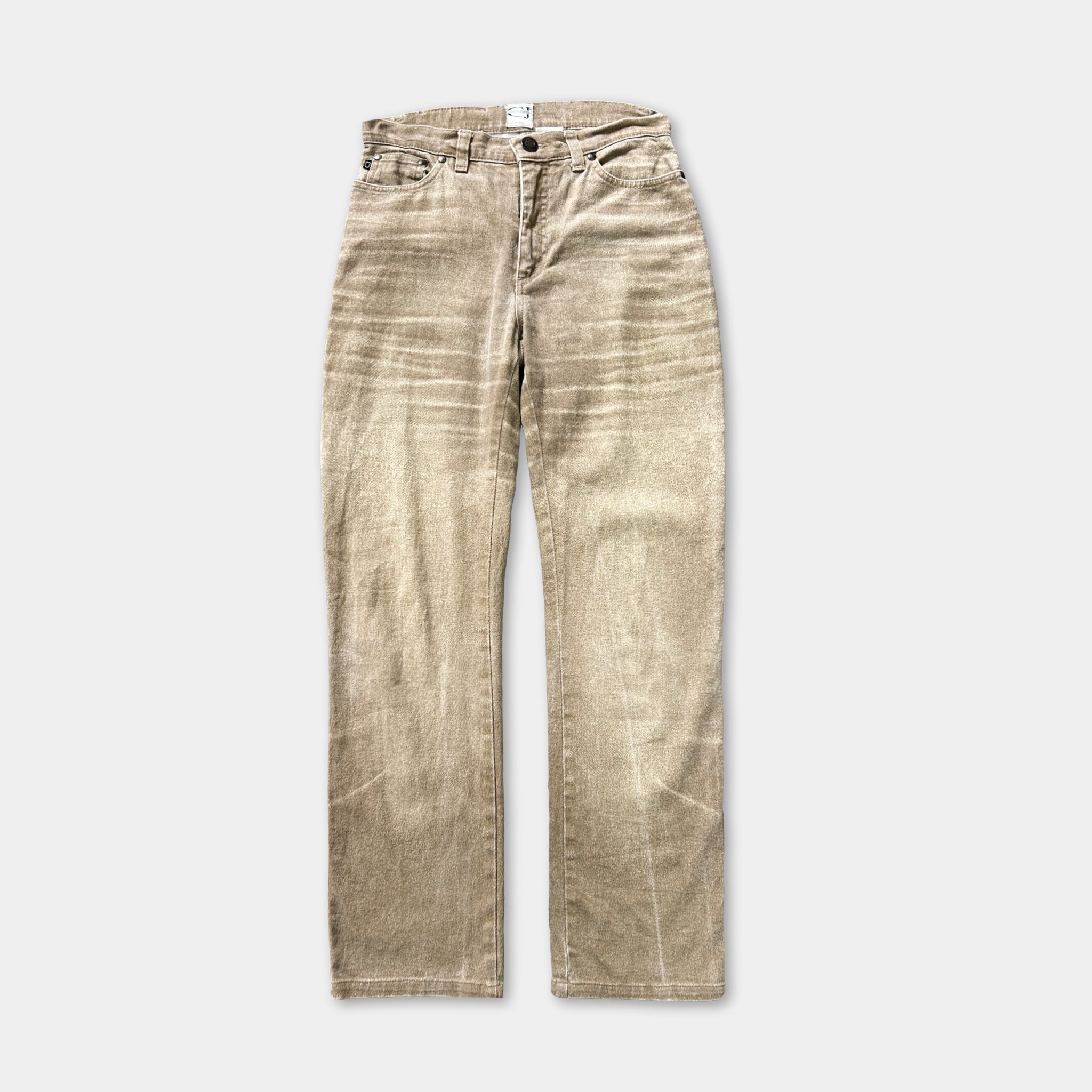 A pair of tan-colored, well-worn jeans with visible signs of wear and tear.