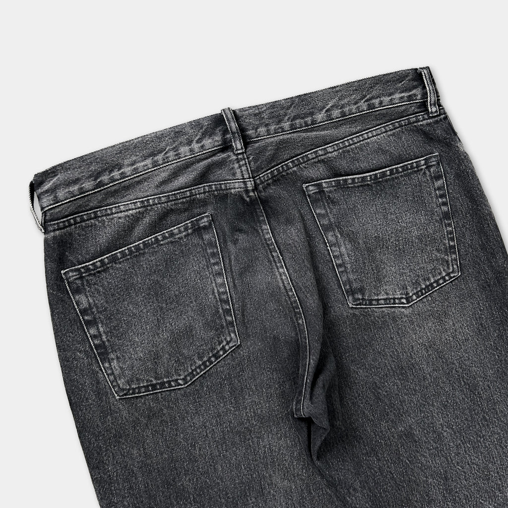 a pair of black jeans with a high waist and two pockets.