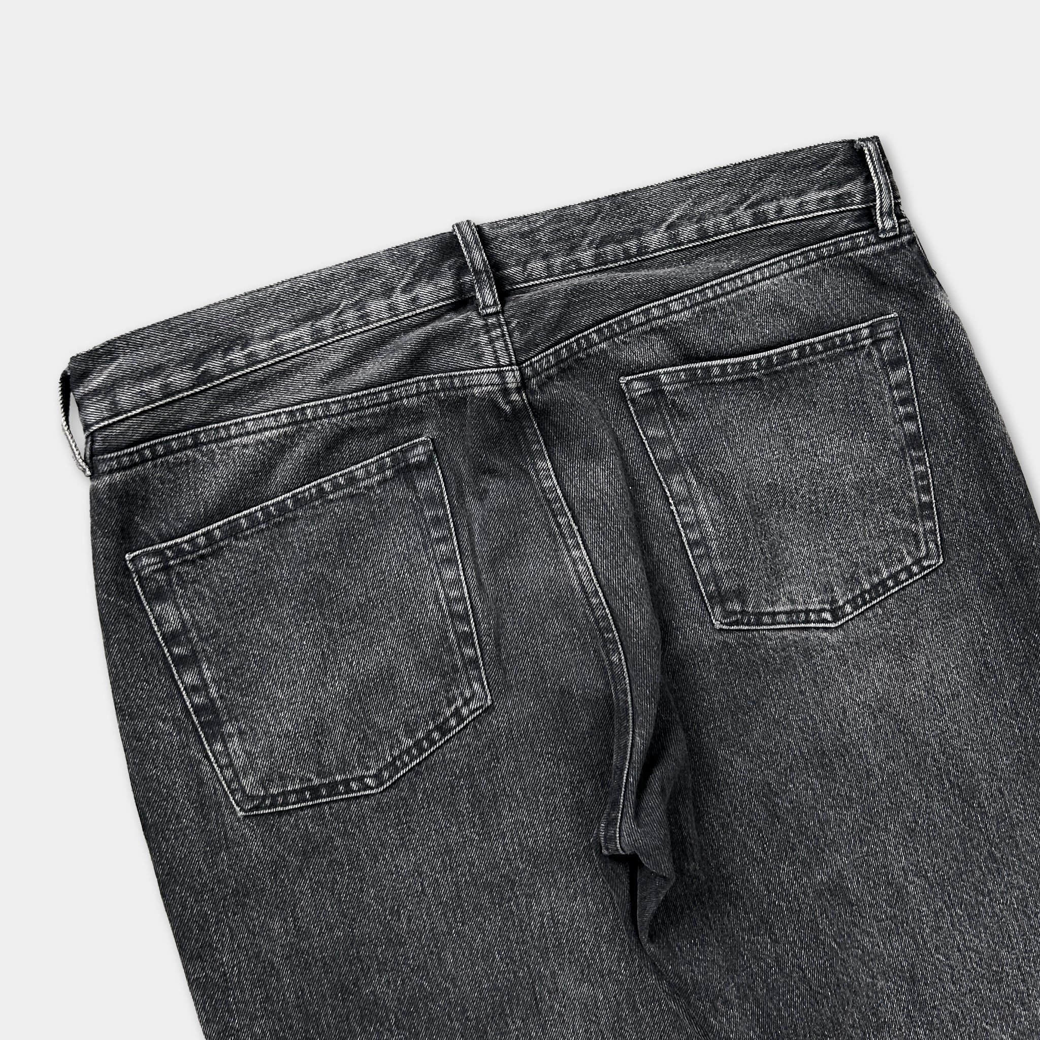 a pair of black jeans with a high waist and two pockets.