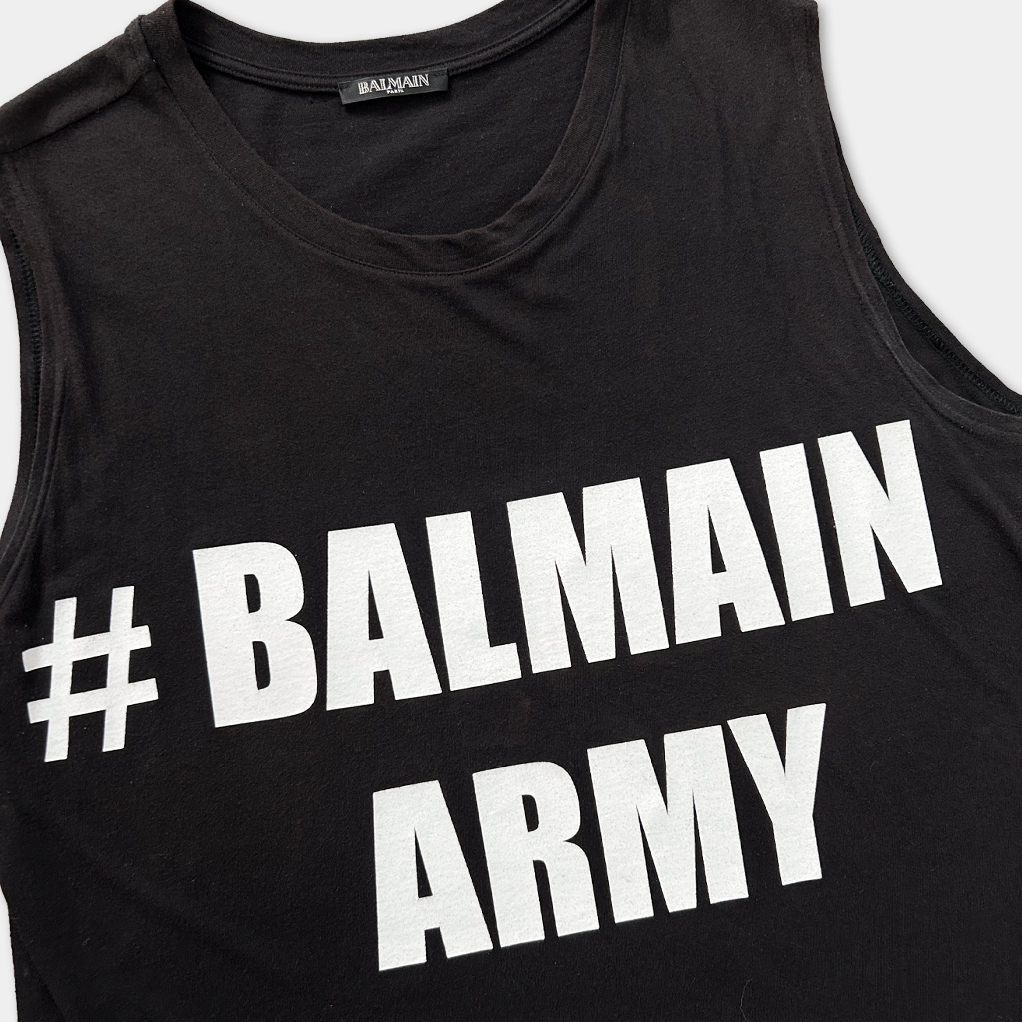 A black tank top with white text printed on it.