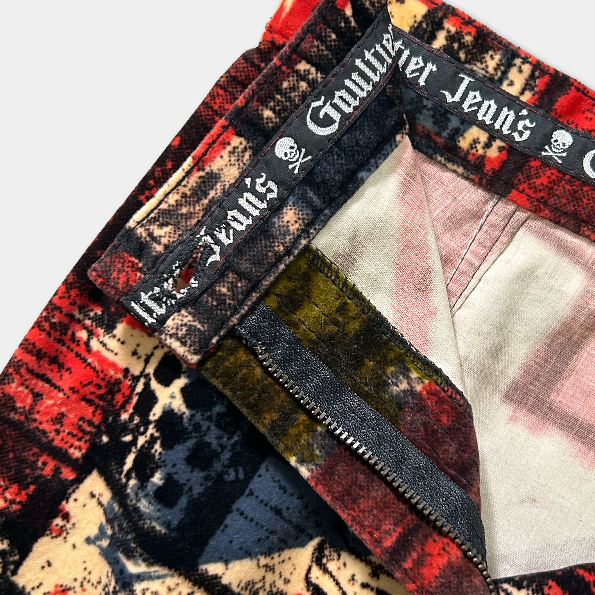 a close-up view of a pair of colorful velvet jeans with a distinctive pattern.