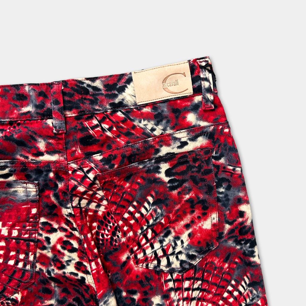 A pair of red and black patterned jeans with a distinctive leopard print design.