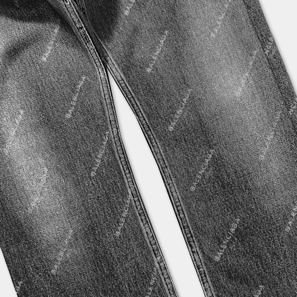 A close-up black and white image of a pair of black jeans with a distinctive pattern.