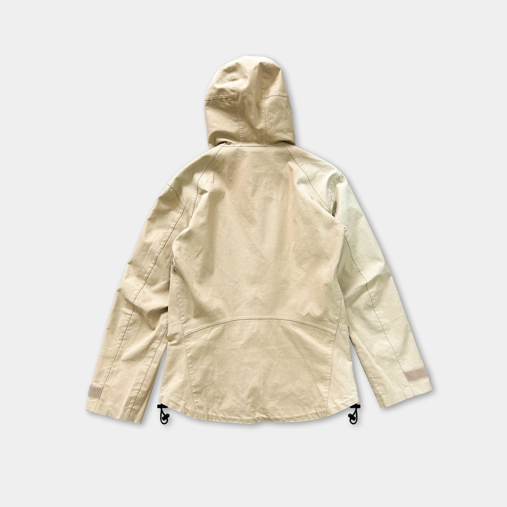 A beige hooded jacket with a hood, featuring a zipper and drawstrings, is shown against a plain white background.