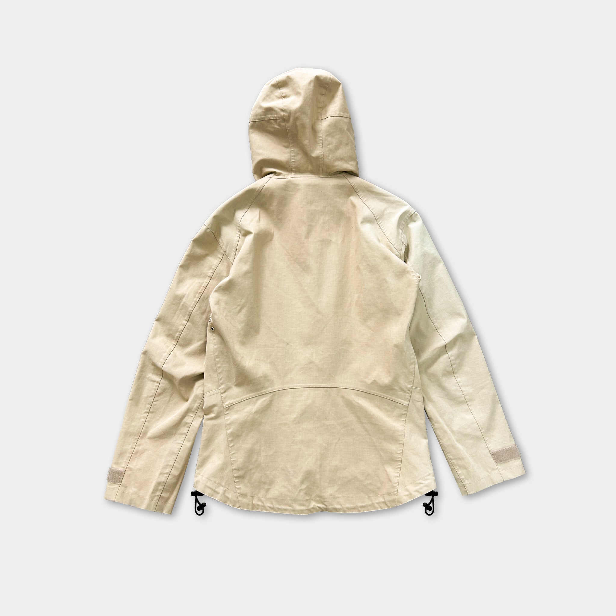 A beige hooded jacket with a hood, featuring a zipper and drawstrings, is shown against a plain white background.