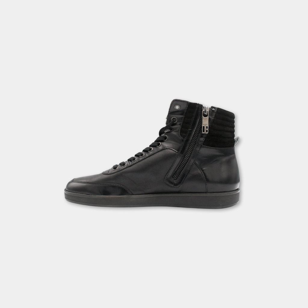 A black leather sneaker with a zipper detail and a high top.