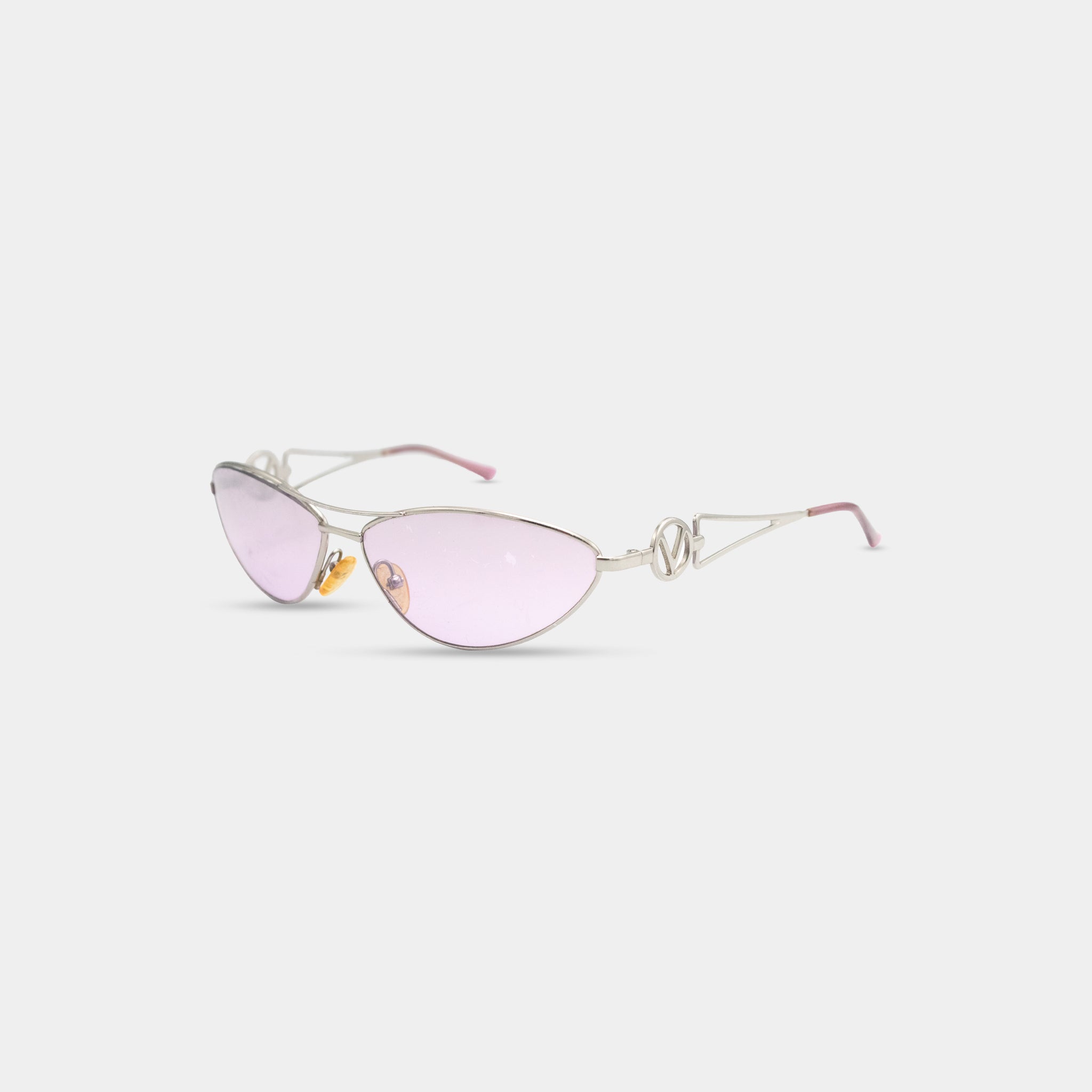A pair of stylish sunglasses with a silver frame and pink lenses.