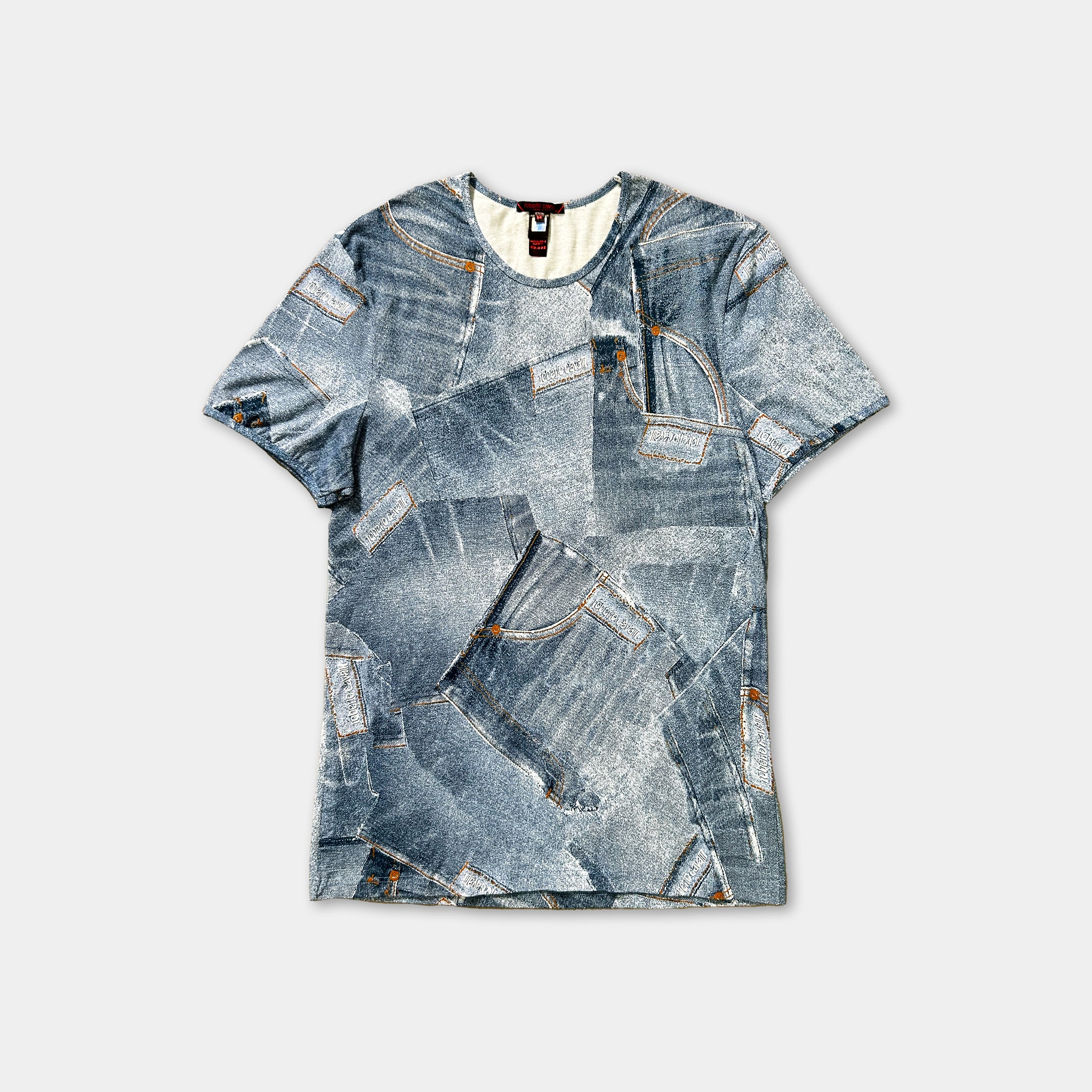 a blue and white patterned t-shirt with a graphic design of jeans or denim-like fabric.