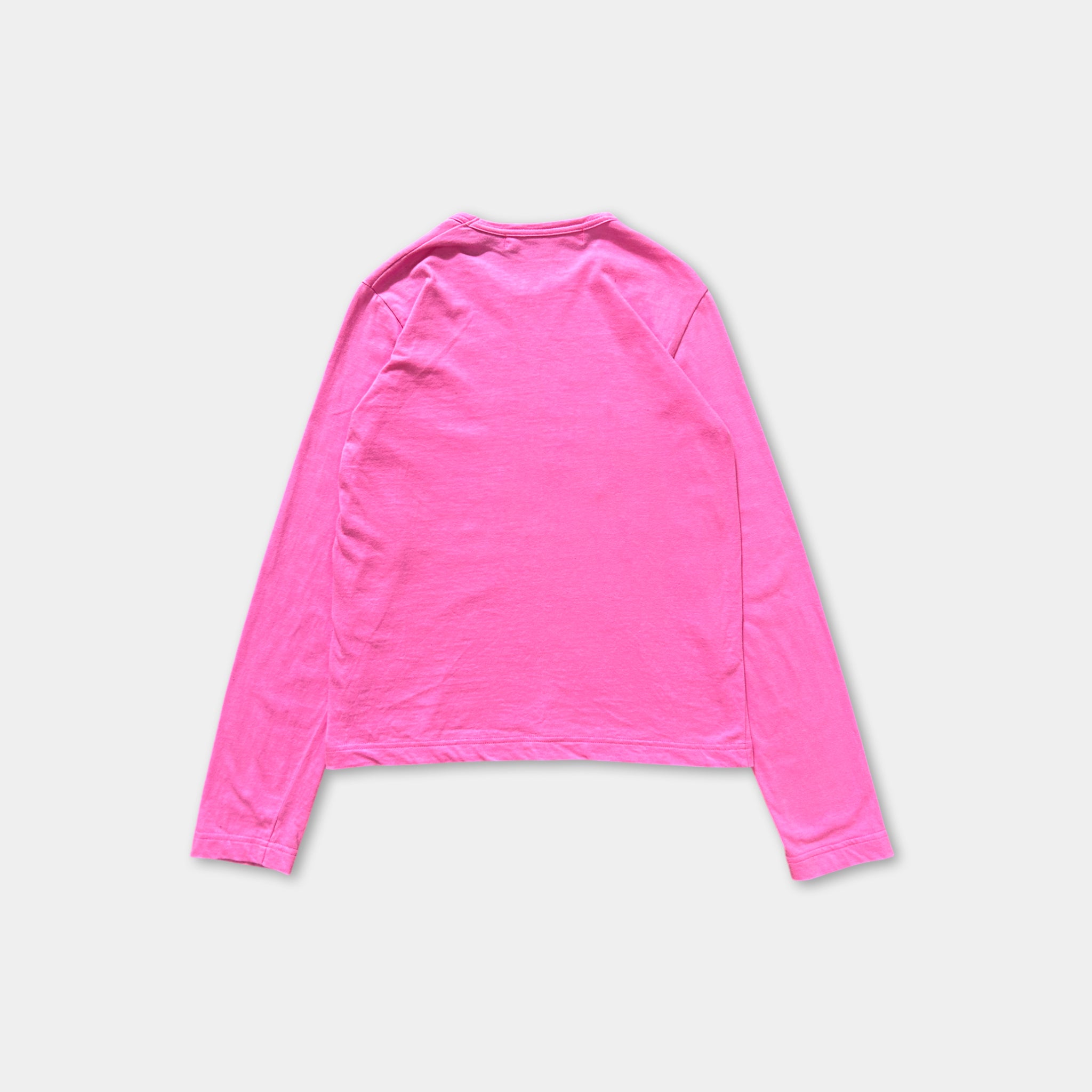 A bright pink long-sleeved shirt is shown against a white background.