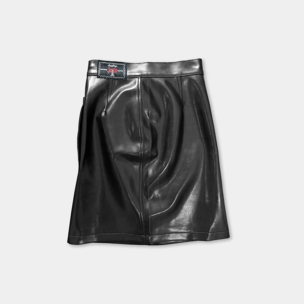 A black leather skirt with a small red logo on the waistband.