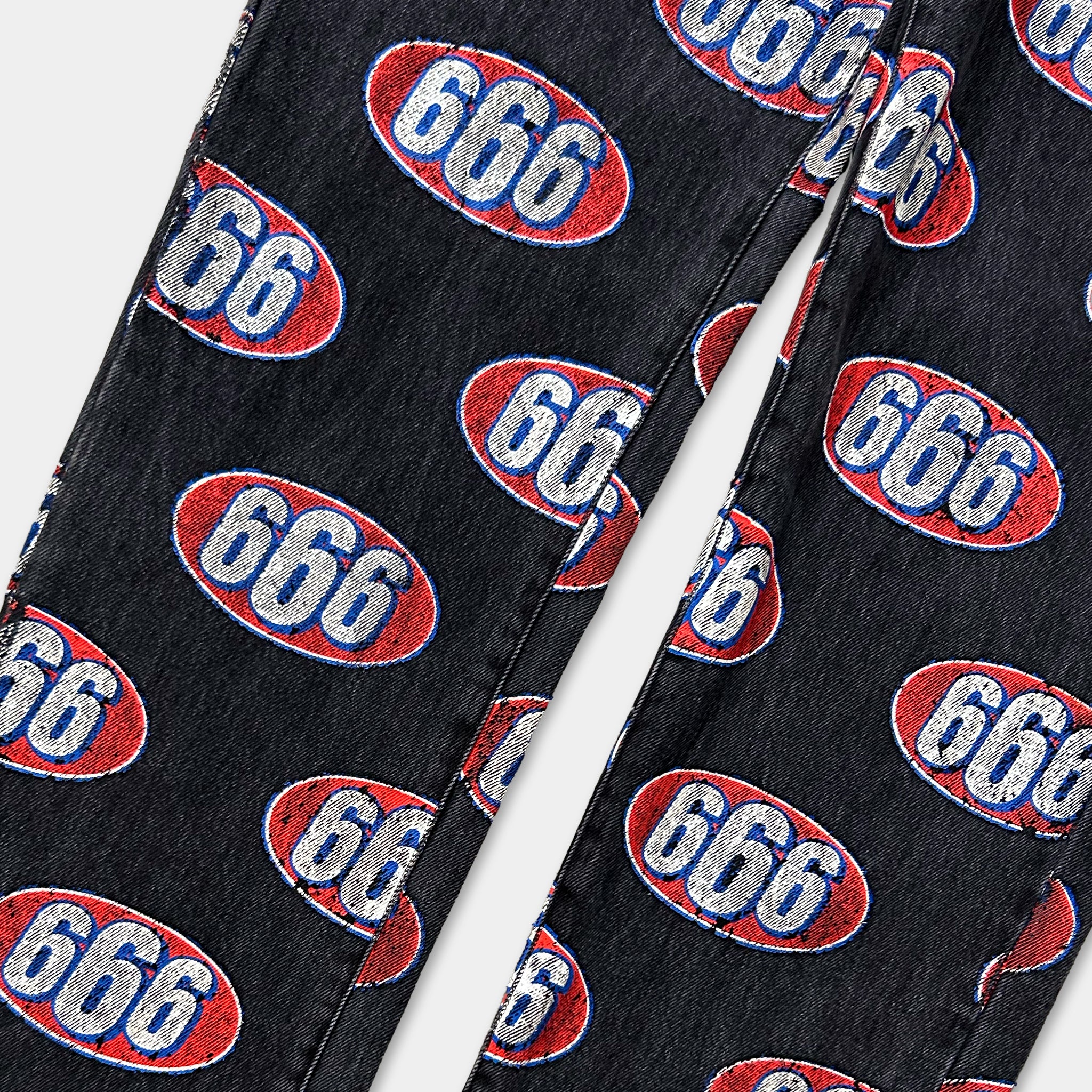 a pair of black jeans with a repeating pattern of the number "666" in red and white colors.