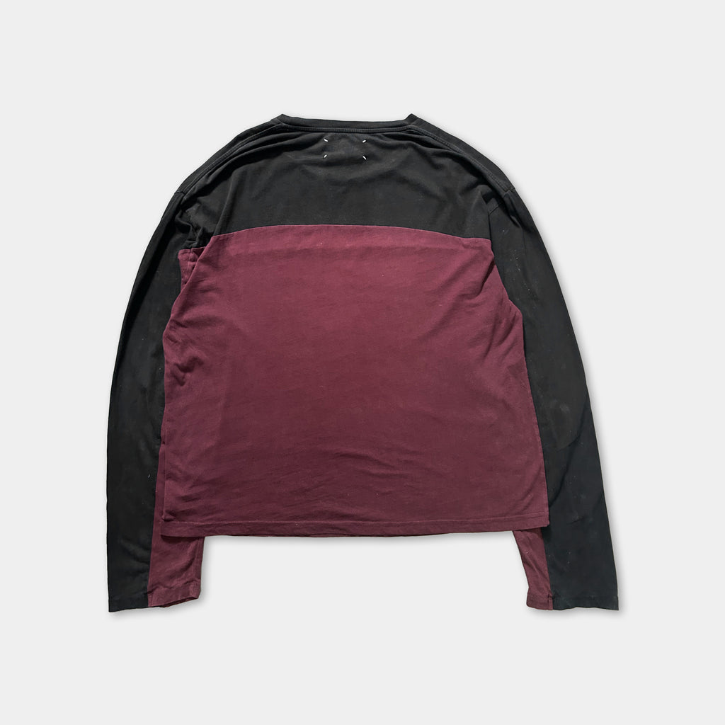 a long-sleeved shirt with a maroon and black color scheme.