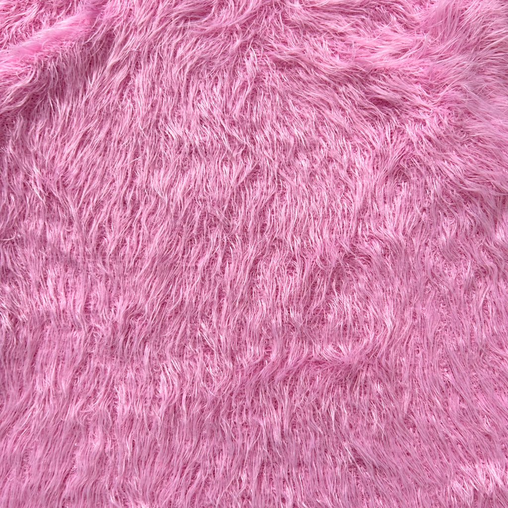 The image is a close-up of a soft, fuzzy pink fabric with a textured, fuzzy appearance.