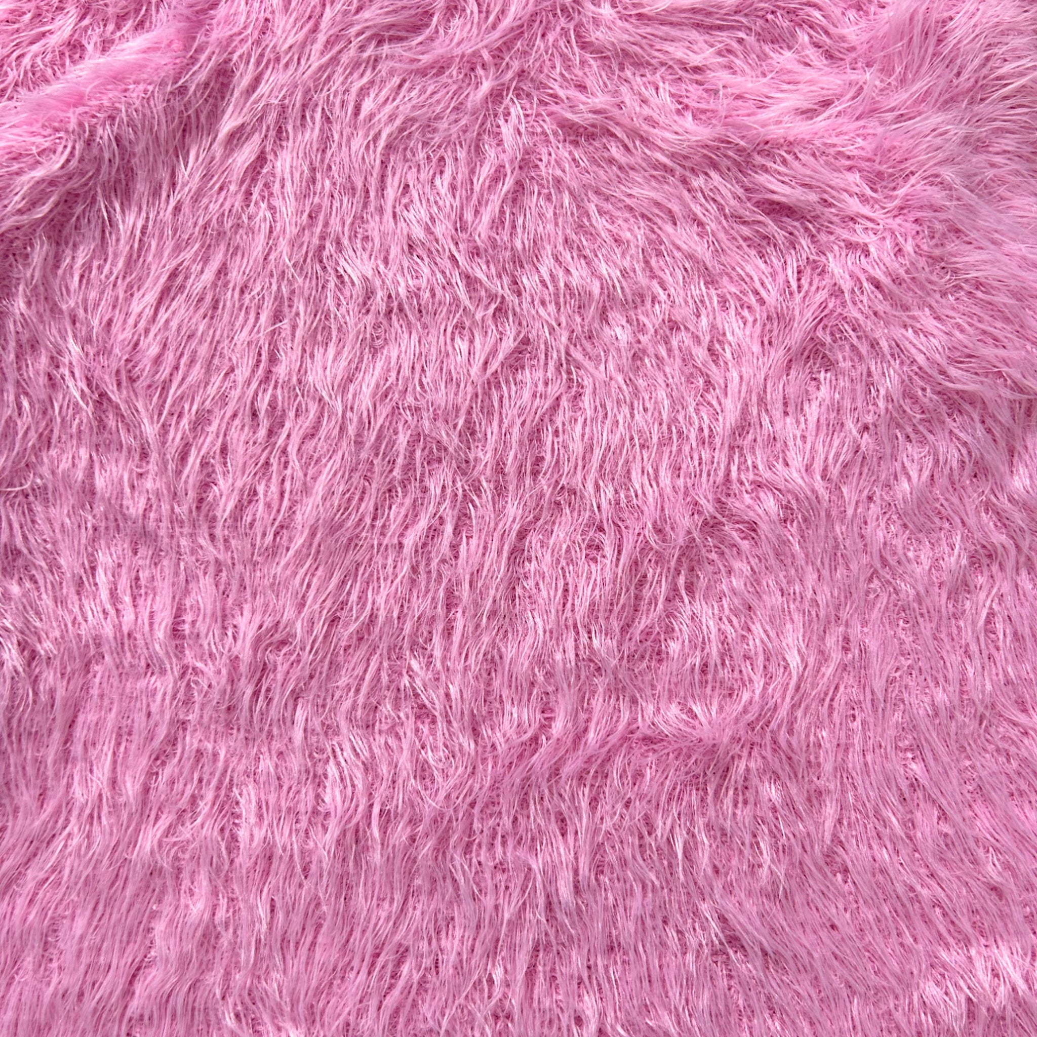The image is a close-up of a soft, fuzzy pink fabric with a textured, fuzzy appearance.