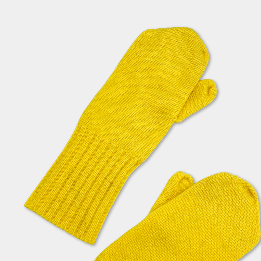 A pair of yellow knit mittens against a white background.
