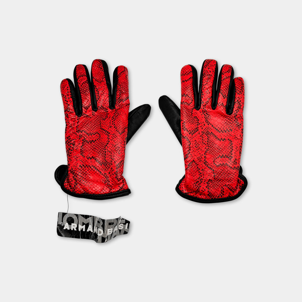 A pair of red and black gloves with a snake skin pattern, placed on a white background.